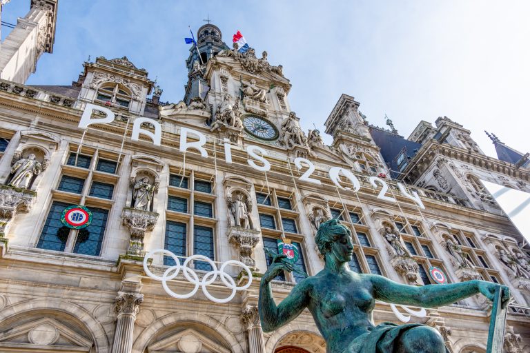 Paris, France - March 4, 2024: Facade of the town hall of Paris, France, decorated for the Olympic and Paralympic Games. Paris is the host city of the 2024 Summer Olympics