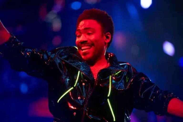 Childish Gambino performing live on tour before postponing shows due to health concerns.