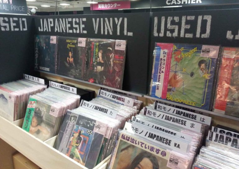A vintage record player playing a Japanese City Pop vinyl, symbolizing the genre’s global resurgence.